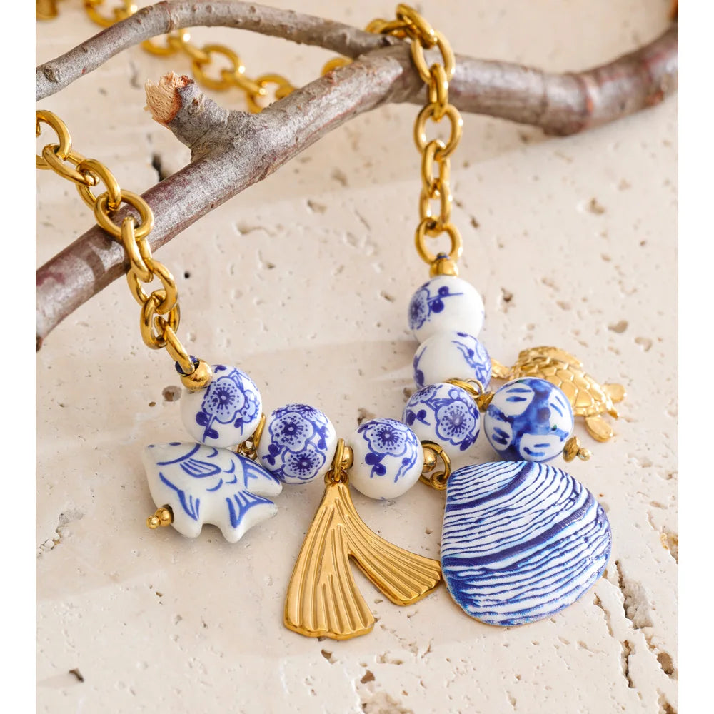 Ocean Catch — Stainless Steel Blue Ceramic Bead Fish & Shell Drop Statement Necklace